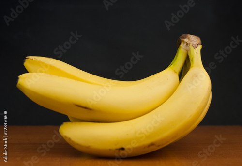 bunch of bananas isolated on black background