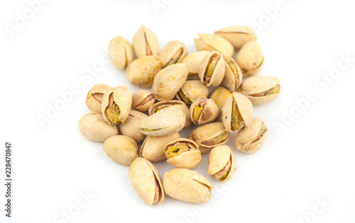 heap of pistachios isolated on white background