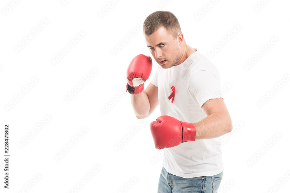 strong handsome man in blank white t-shirt with aids awareness red ribbon and boxing gloves isolated on white, fighting aids concept strong handsome man in blank white t-shirt with aids awareness red ribbon and boxing gloves isolated on white, fighting aids concept