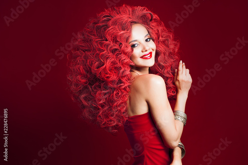 Wow girl with unbelievable lush hair. Portrait of beautiful young woman with red hair