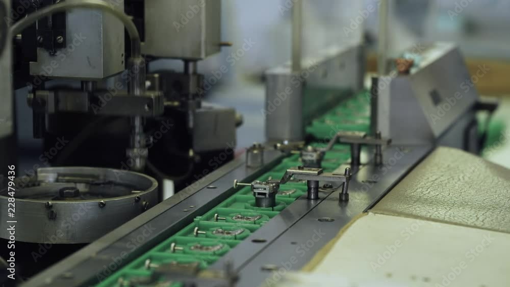 Production of watches, process of assembling the mechanism of a wristwatch machine CNC, gears and parts. Production of watches, process of assembling the mechanism of a wristwatch machine CNC, gears and parts.