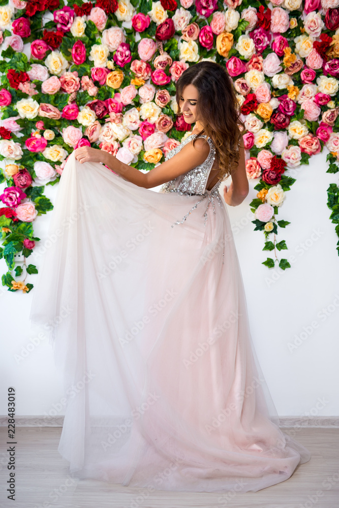 full length portrait of beautiful girl in dress over colorful flowers background full length portrait of beautiful girl in dress over colorful flowers background