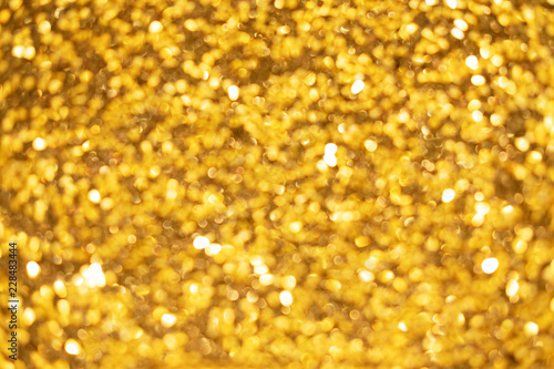 Gold glitter texture. Vector background with golden metallic effects.