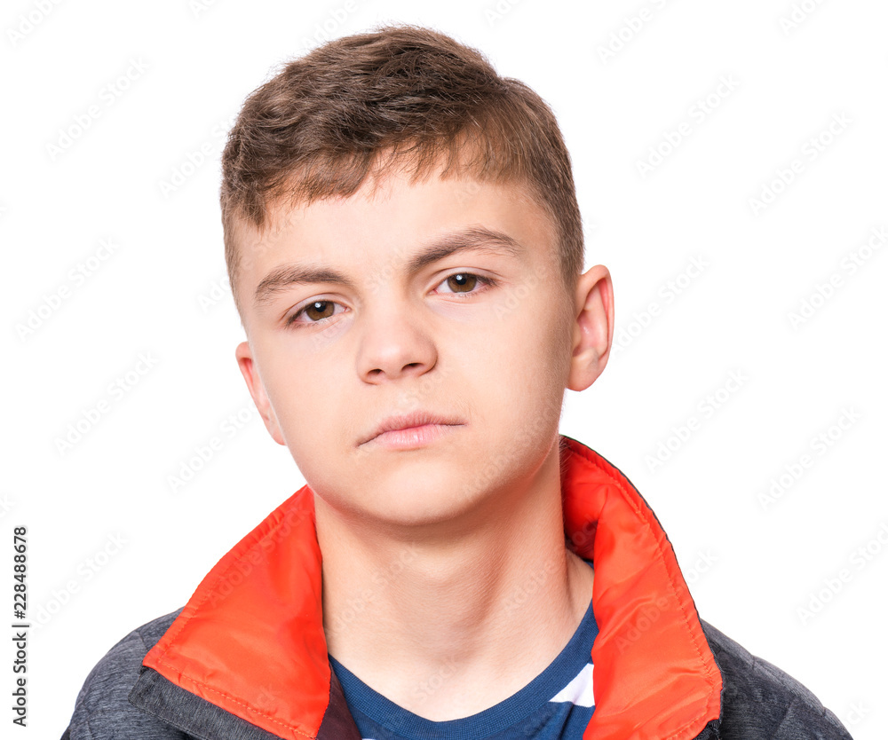 Emotional portrait of caucasian teen boy. Serious, sad or thoughtful handsome young teenager - close up. Studio head shot - isolated on white background. Emotional portrait of caucasian teen boy. Serious, sad or thoughtful handsome young teenager - close up. Studio head shot - isolated on white background.