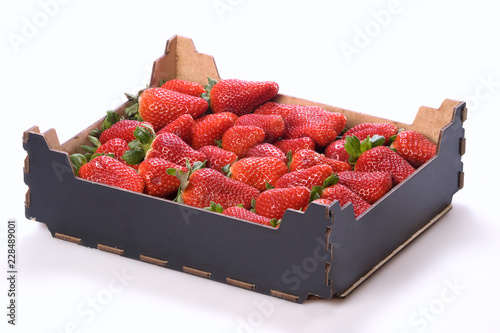Box of strawberries on white background