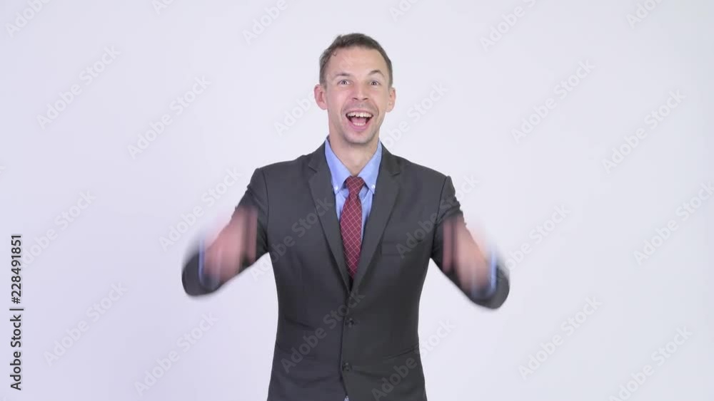 Studio shot of happy businessman getting good news Studio shot of happy businessman getting good news