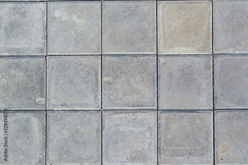 Grey square stone ground paving texture and background