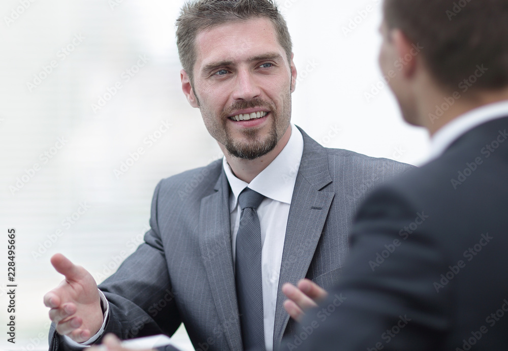closeup.business colleagues sitting at a Desk.