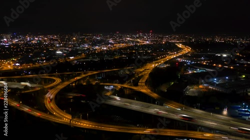 Birmingham aerial hyperlapse view of spaghetti junction motorway traffic at night. photo