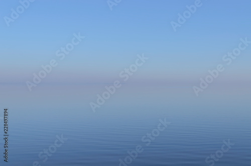 Blue Misty sunset over the River with pink horizon
