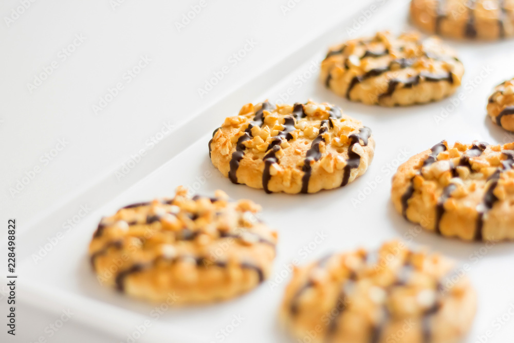 Shortbread cookies with nuts and chocolate on a tray Shortbread cookies with nuts and chocolate on a tray