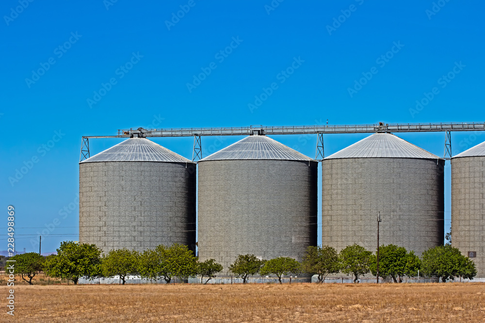 Three large grain storage silos