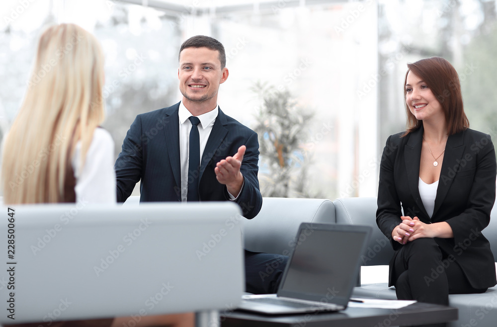 business team discussing business issues in office business team discussing business issues in office