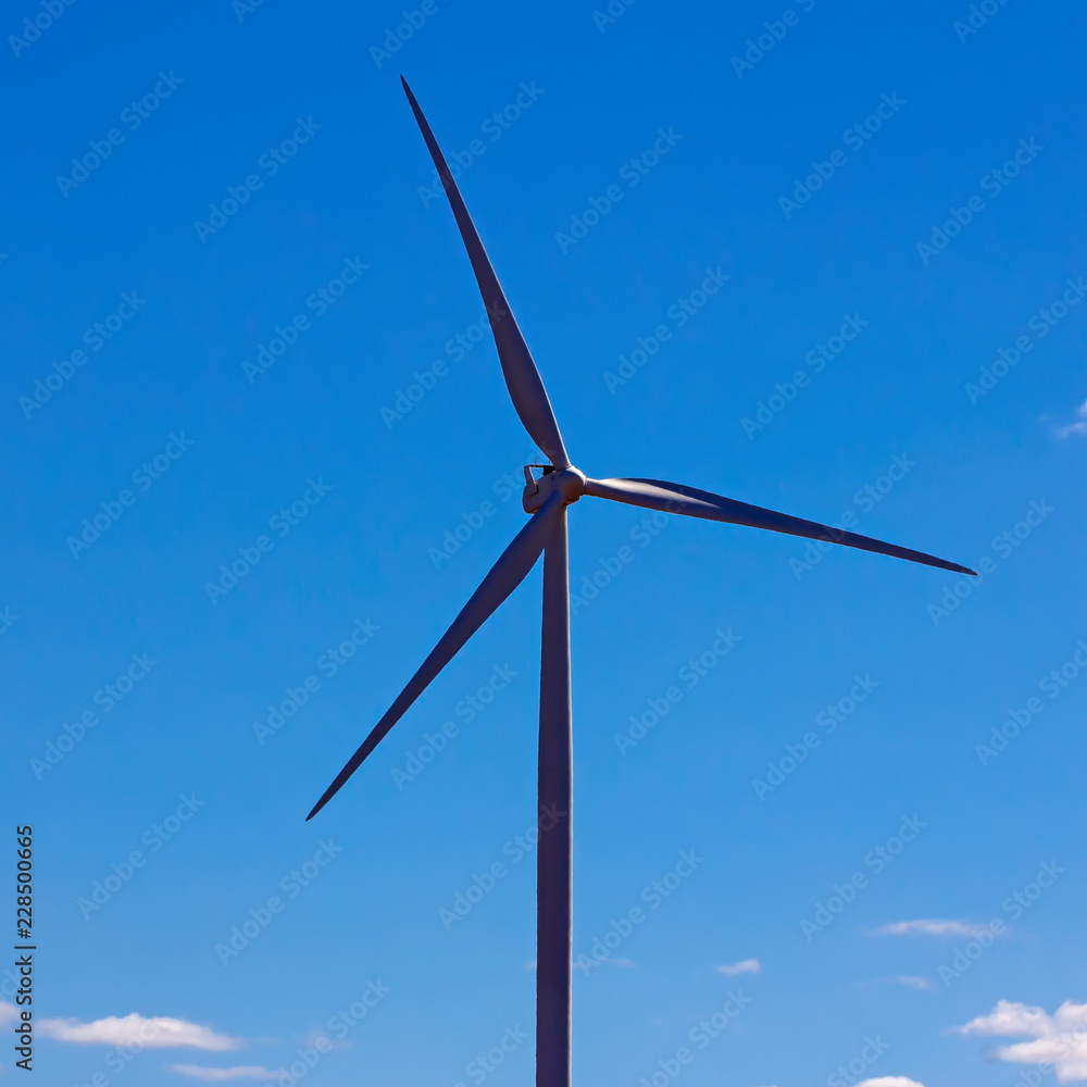 Single wind turbine and blue sky Single wind turbine and blue sky