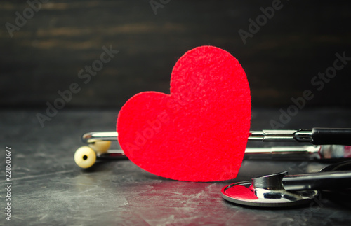 Red heart and stethoscope. The concept of medicine and health insurance, family, life. Ambulance. Cardiology Healthcare. © Andrii Yalanskyi