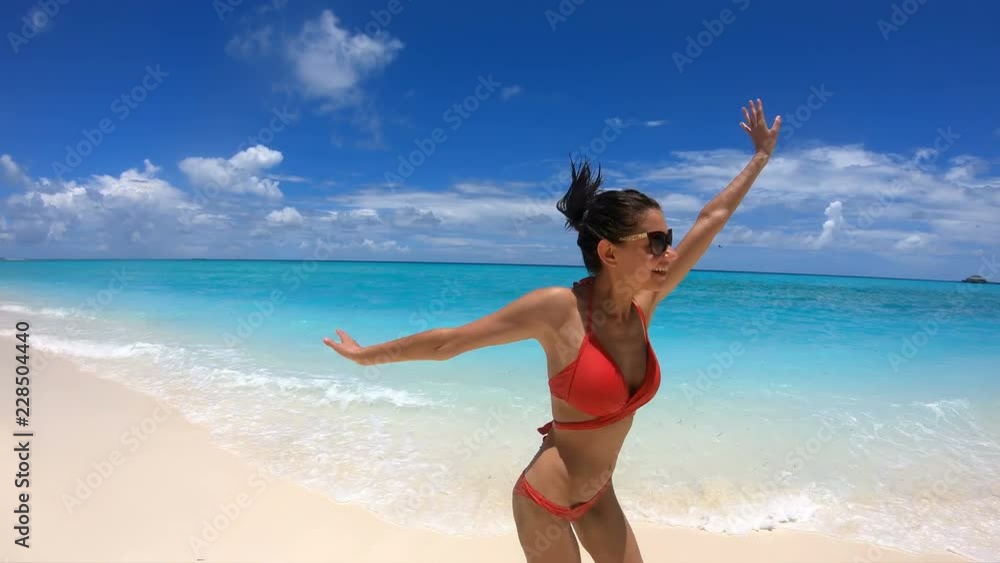 Slow Motion Happy Girl Runs on the Coast of Maldives, 4K Slow Motion Happy Girl Runs on the Coast of Maldives, 4K