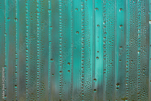 abstract background with big and small water drops in different colors - sea blue and green color © a_darya