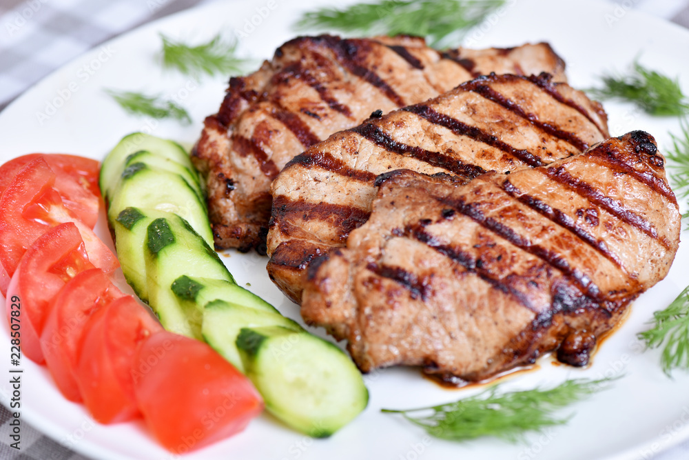Grilled meat. Restaurant dish. Steak with vegetables.