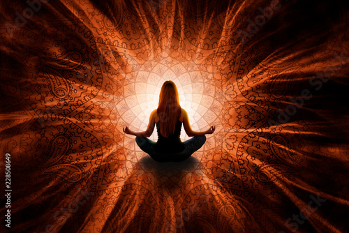 Woman in meditation with mandala