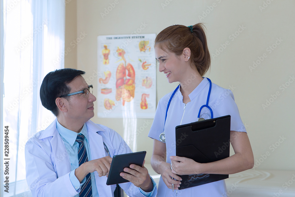 Friendly medical team working together in medical office. Friendly medical team working together in medical office.