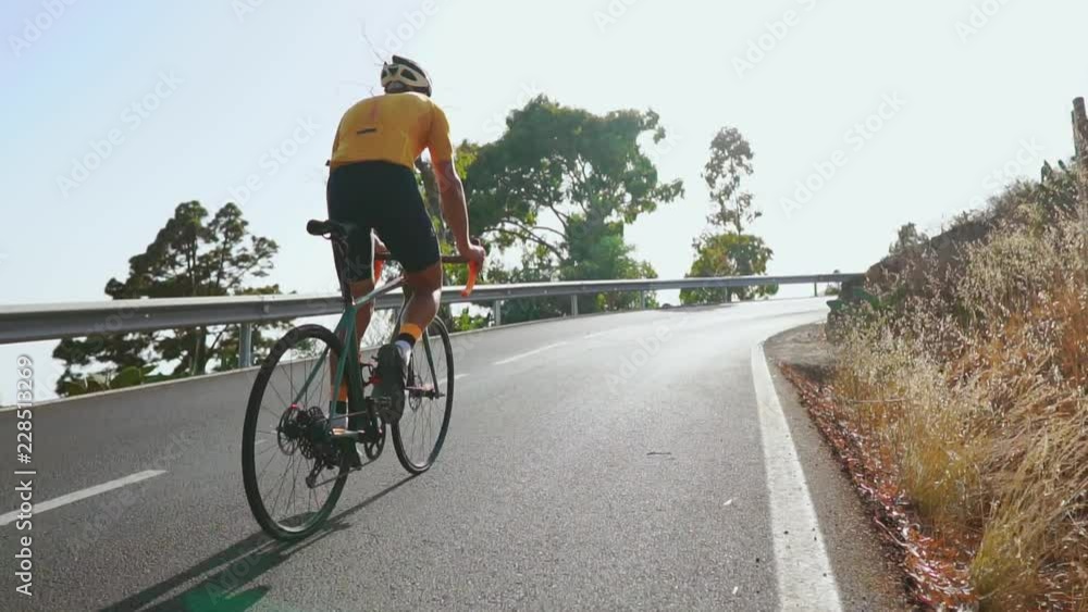 Man cycling on road bike outdoor exercise on an empty road in the