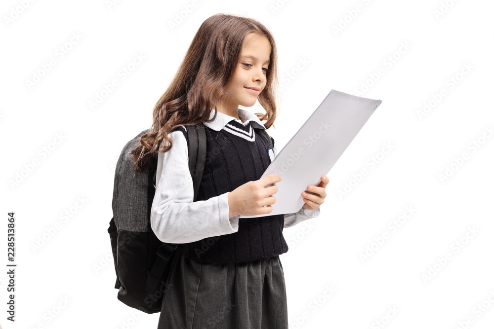 Happy little schoolgirl looking at a test Happy little schoolgirl looking at a test