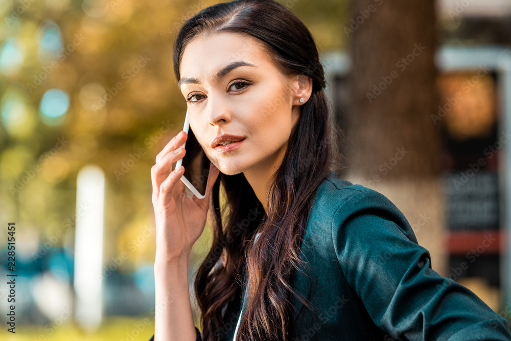 portrait of beautiful businesswoman talking by smartphone on street portrait of beautiful businesswoman talking by smartphone on street
