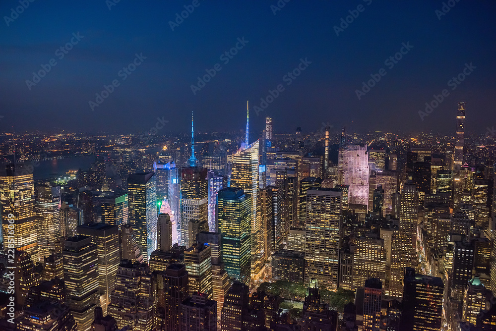 View of the night city and glowing skyscrapers from a height. New York. USA.
