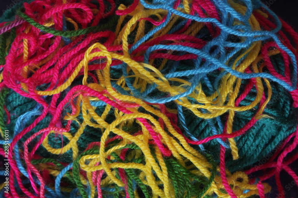 Tangled multicolored threads making a colorful texture