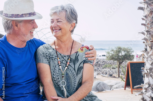 Sticker Happy senior couple laughing hugged on a summer day
