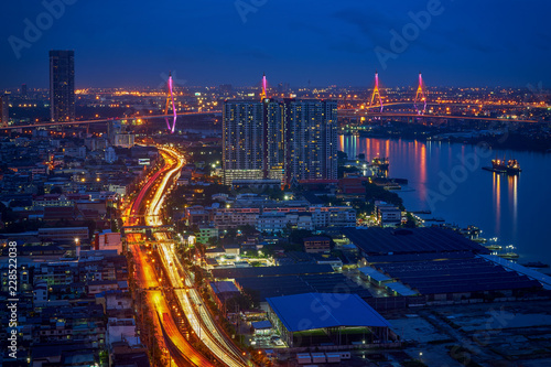 wonderful cityscape with long light tail of traffic road and river