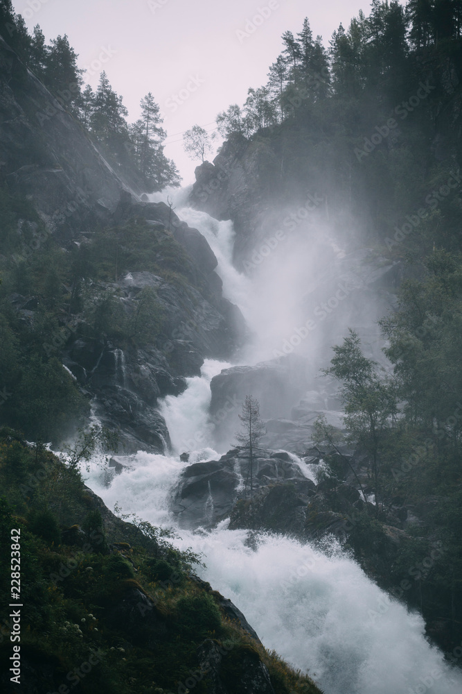 Rapid and powerful  mountain  waterfall in Norway 