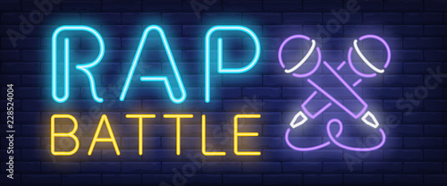 Rap battle neon text with two microphones. Concert and youth culture advertisement design. Night bright neon sign, colorful billboard, light banner. Vector illustration in neon style.