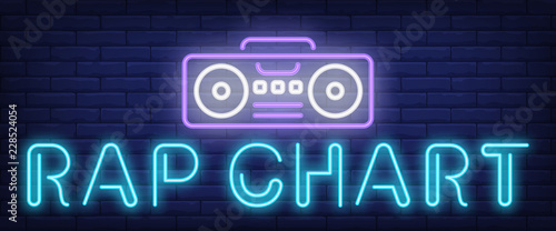 Rap chart neon text with boombox. Modern music and youth culture advertisement design. Night bright neon sign, colorful billboard, light banner. Vector illustration in neon style.