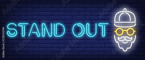 Stand out neon text with hipster head. Modern youth culture advertisement design. Night bright neon sign, colorful billboard, light banner. Vector illustration in neon style.