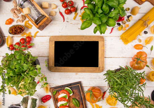 Italian food ingredients on old wooden background