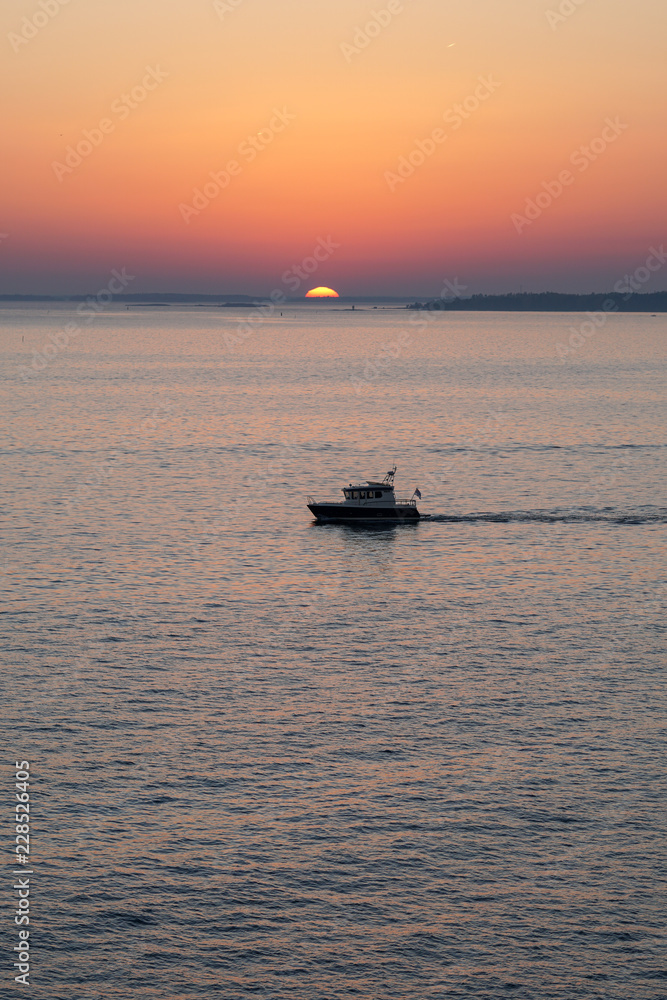 Boat's heading towards the sunset