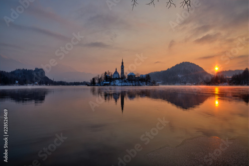 Lake Bled with the church during winter morning.