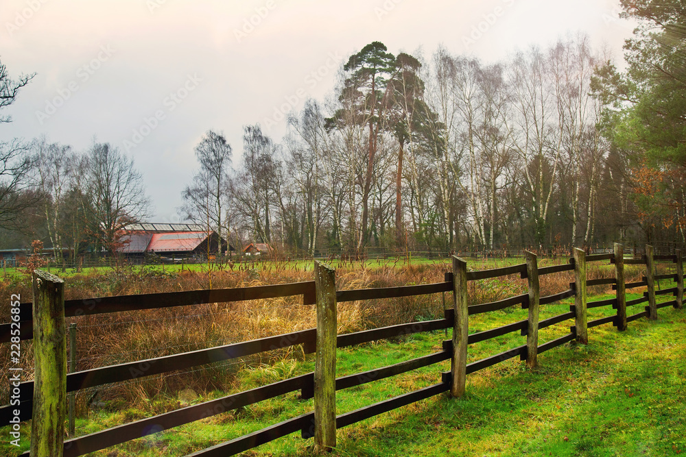 Wooden Fences around Barn and Trees