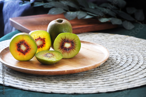 Plate of Fresh Red Kiwifruit on Table