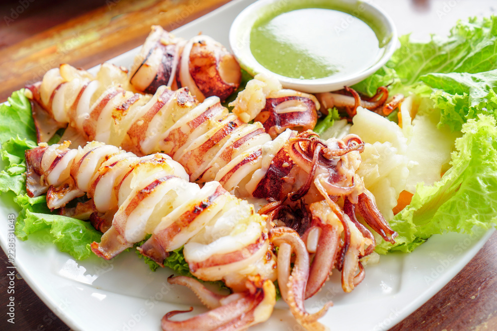 Slice of Grilled squid with Thai seafood sauce.2 Slice of Grilled squid with Thai seafood sauce.2