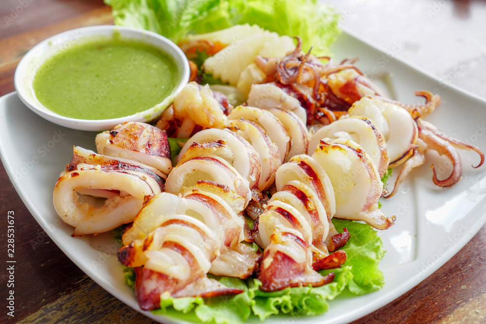 Slice of Grilled squid with Thai seafood sauce.1 Slice of Grilled squid with Thai seafood sauce.1