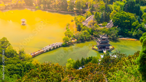 Suocui Bridge over Black Dragon Pool at Moon Embracing Pavilion in Jade Spring Park, Lijiang, China. Aerial view