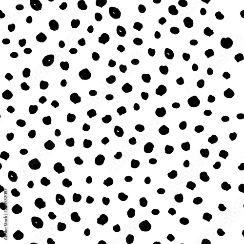 Vector seamless black dot pattern with spreading grunge circle spots isolated on white background. Freehand drawing vector diffused points.
