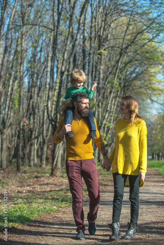 Happy family and little child with paper plane enjoy free time outdoor, freedom concept. Freedom of movement. We are free