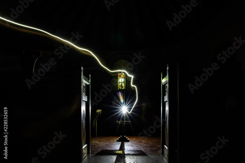 A representation of 'A spirit exiting the soul of a priest' in a creepy church
