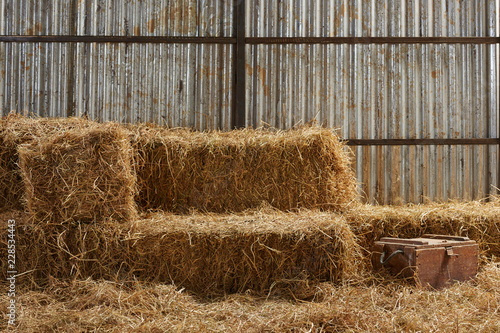 Behang hay stacks in barn house with zinc wall