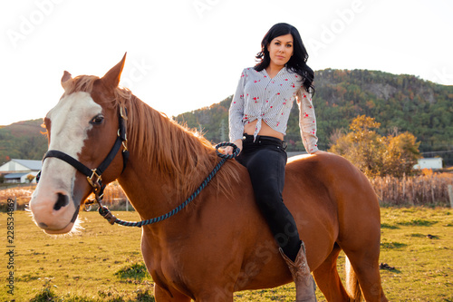 A Woman with her horse at sunset, autumn outdoors scene