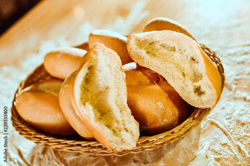 bread in a basket on a table covered in flour bread in a basket on a table covered in flour