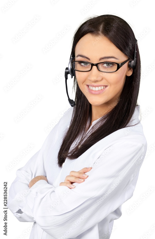 Young Woman with Arms Folded Talking on Headset - Isolated Young Woman with Arms Folded Talking on Headset - Isolated